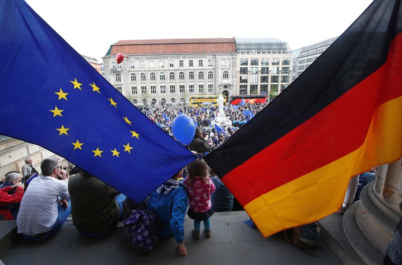 &copy; Reuters. FILE PHOTO: Participants of the Pro-Europe "Pulse of Europe" movement hold European Union and German flags during a protest at Gendarmenmarkt square in Berlin, Germany, April 2, 2017.      REUTERS/Fabrizio Bensch/File Photo