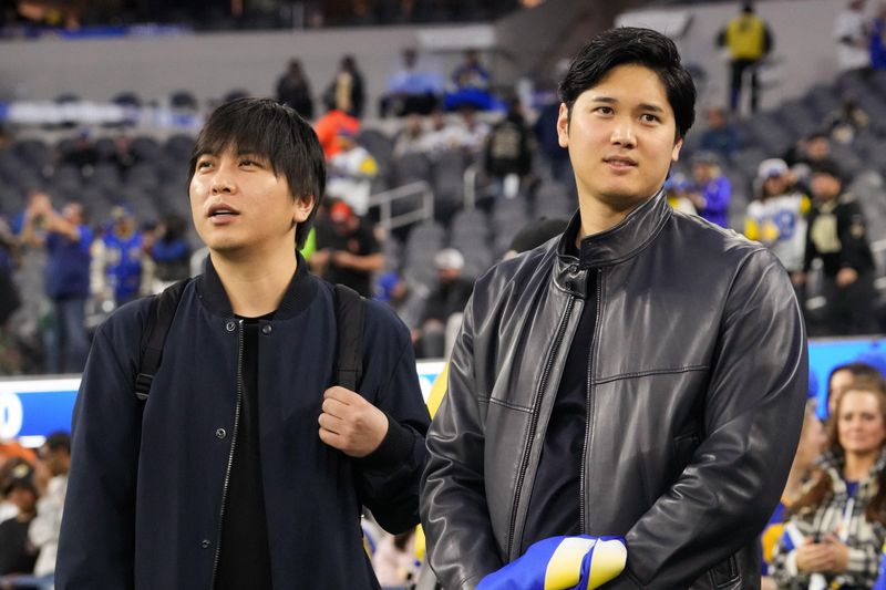 &copy; Reuters. FILE PHOTO: Dec 21, 2023; Inglewood, California, USA; Los Angeles Dodgers player Shohei Ohtani (right) and interpreter Ippei Mizuhara attend the game between the Los Angeles Rams and the New Orleans Saints at SoFi Stadium. Mandatory Credit: Kirby Lee-USA 