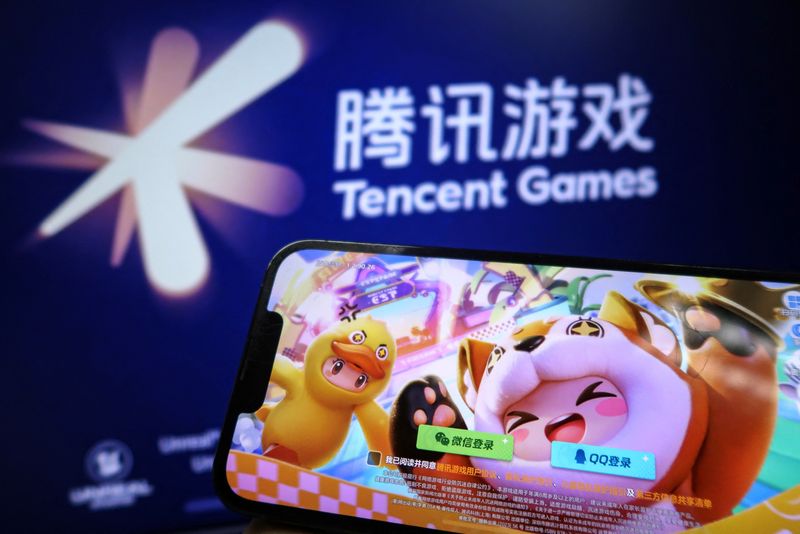 &copy; Reuters. "DreamStar", a mobile game by Tencent, is seen on a mobile phone next to a logo of Tencent Games, in this illustration picture taken March 19, 2024. REUTERS/Tingshu Wang/Illustration