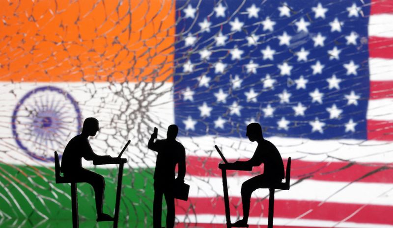&copy; Reuters. FILE PHOTO: The Indian flag, the U.S. flag and people miniatures, some with laptops, are seen through broken glass in this illustration taken March 10, 2024. REUTERS/Dado Ruvic/Illustration/File Photo
