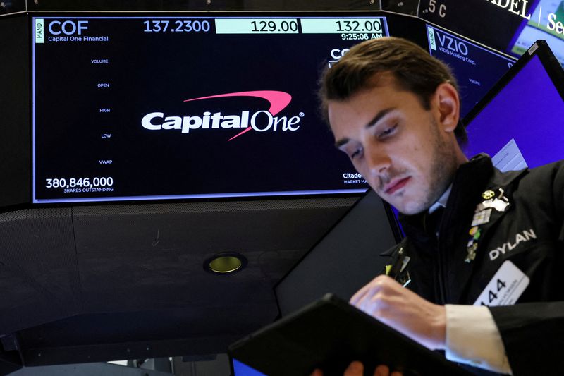 &copy; Reuters. FILE PHOTO: A screen displays the logo and trading information for Capital One Financial as a trader works on the floor at the New York Stock Exchange (NYSE) in New York City, U.S., February 20, 2024.  REUTERS/Brendan McDermid/File Photo