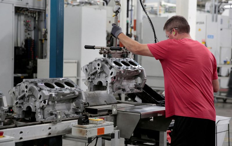 &copy; Reuters. FILE PHOTO: A General Motors assembly worker loads engine block castings on to the assembly line at the GM Romulus Powertrain plant in Romulus, Michigan, U.S. August 21, 2019. Picture taken August 21, 2019. Rebecca Cook/File Photo