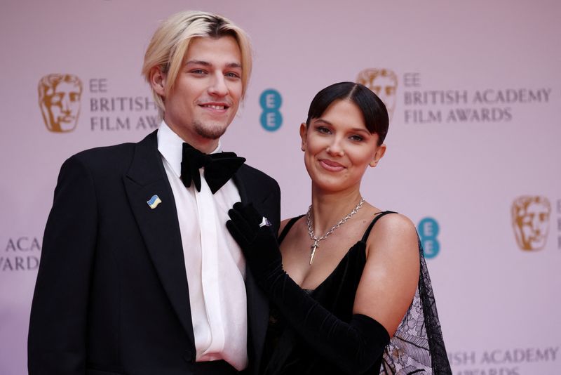 &copy; Reuters. FILE PHOTO: Millie Bobby Brown and Jake Bongiovi arrive at the 75th British Academy of Film and Television Awards (BAFTA) at the Royal Albert Hall in London, Britain, March 13, 2022. REUTERS/Henry Nicholls/File Photo