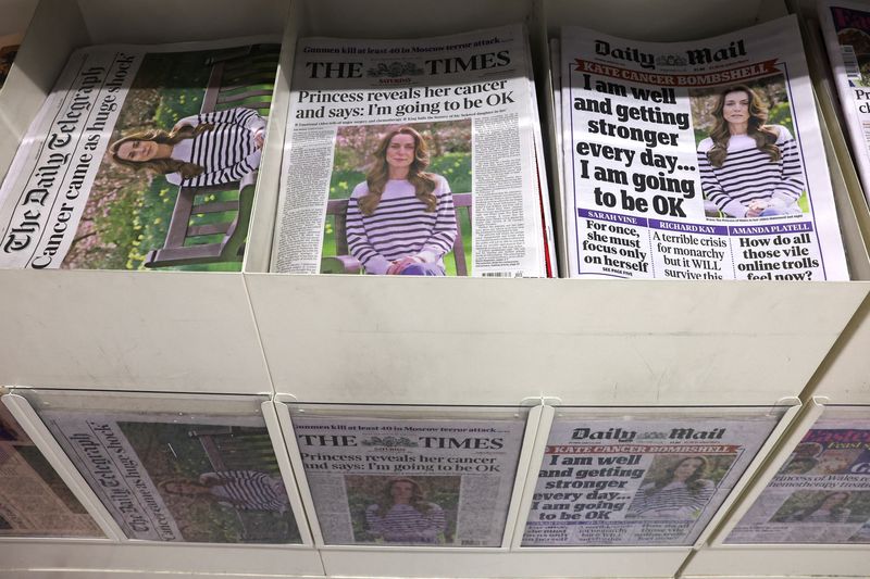 &copy; Reuters. British newspaper front pages are displayed at a supermarket, all carrying the headline that Britain's Catherine, Princess of Wales has revealed she is undergoing preventative chemotherapy after tests taken following abdominal surgery in January revealed 