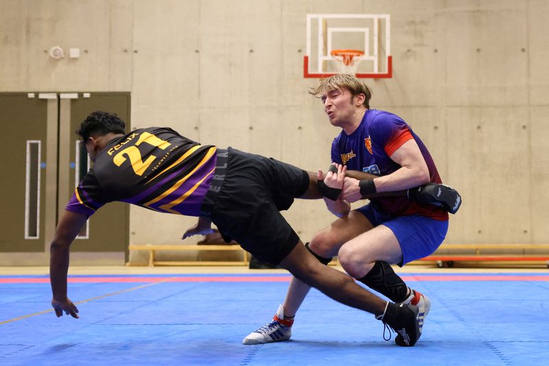 &copy; Reuters. George Wellington tackles a player during a Kabaddi match at the London School of Economics, in London, Britain, March 24, 2024. REUTERS/Hollie Adams