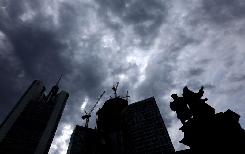 &copy; Reuters. FILE PHOTO: Dark clouds are seen over the construction site of "4 Frankfurt" skyscraper next to the statue of German inventor Johannes Gutenberg and Commerzbank tower in Frankfurt, Germany, July 19, 2023. REUTERS/Kai Pfaffenbach/File Photo