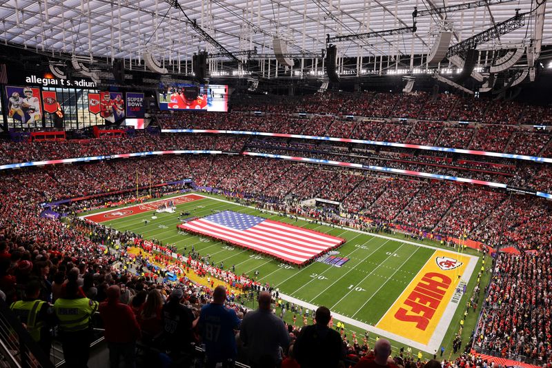 &copy; Reuters. FILE PHOTO: Football - NFL - Super Bowl LVIII - Kansas City Chiefs v San Francisco 49ers - Allegiant Stadium, Las Vegas, Nevada, United States - February 11, 2024 A general view of a flag of the United States on the field before the game REUTERS/Mike Blak