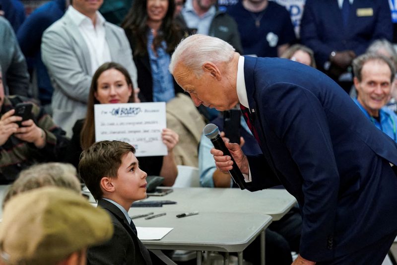 &copy; Reuters. FILE PHOTO: U.S. President Joe Biden greets 9-year-old Harry Abramson, who has a severe stutter and wrote a letter to President Biden, who also stutters, about how the president has given him more confidence, at the campaign headquarters for the state of 