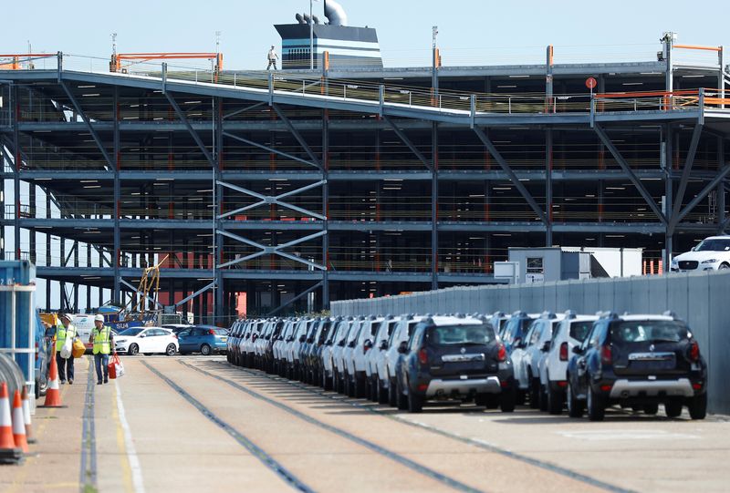 &copy; Reuters. Cars readied for export are parked next to a vehicle storage facility on the dockside at the ABP port in Southampton, Britain August 16, 2017. Picture taken August 16, 2017.  REUTERS/Peter Nicholls/File Photo