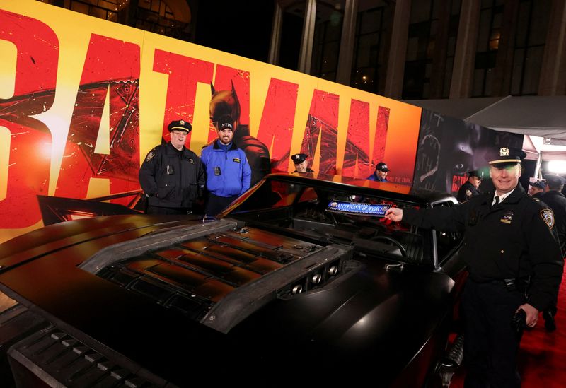 &copy; Reuters. FILE PHOTO: NYPD officers pose next to a "Batmobile" during the New York Premiere of "The Batman", in New York City, U.S. March 1, 2022. REUTERS/Caitlin Ochs/File Photo