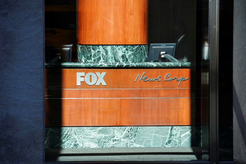&copy; Reuters. FILE PHOTO: A view of the signage in the lobby of the News Corporation building, after it was announced that Rupert Murdoch would step down as chairman of News Corp and Fox in favour of his son Lachlan Murdoch, in New York, U.S., September 21, 2023.  REUT