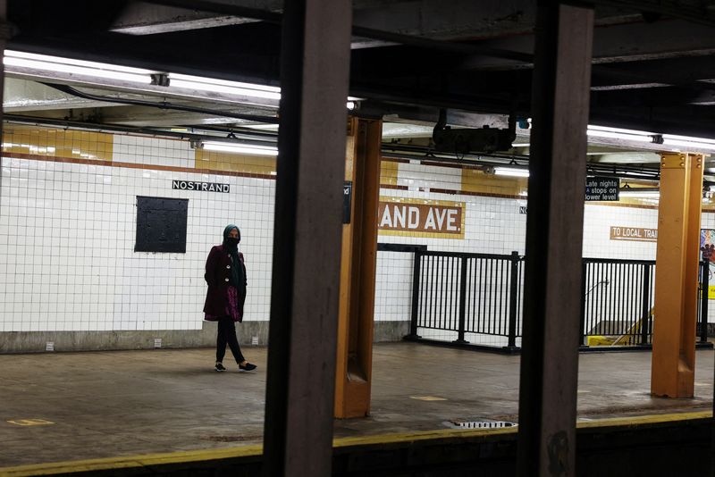 &copy; Reuters. FILE PHOTO: A woman waits for a subway to arrive at the Nostrand Avenue station subway platform in the Brooklyn borough of New York City, U.S., March 12, 2024. REUTERS/Shannon Stapleton/File Photo