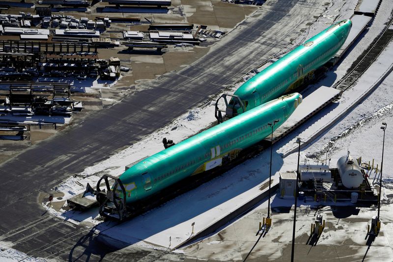 &copy; Reuters. FILE PHOTO: Airplane fuselages bound for Boeing's 737 Max production facility await shipment on rail sidings at their top supplier, Spirit AeroSystems Holdings Inc, in Wichita, Kansas, U.S. December 17, 2019. REUTERS/Nick Oxford/File Photo
