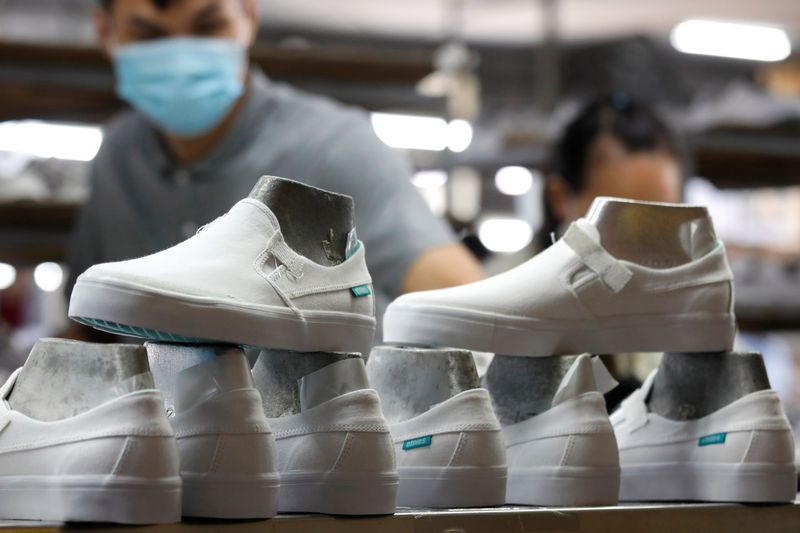&copy; Reuters. Shoes for export are seen at a shoe factory in Hanoi, Vietnam December 29, 2020. REUTERS/Kham/ File Photo
