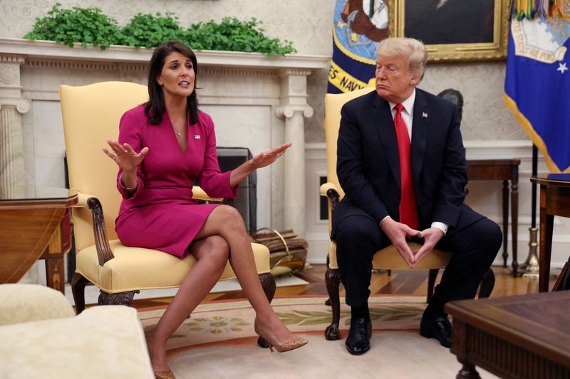 © Reuters. FILE PHOTO: Outgoing U.S. Ambassador to the United Nations Nikki Haley talks with President Donald Trump in the Oval Office of the White House after the president accepted Haley's resignation in Washington, U.S., October 9, 2018. REUTERS/Jonathan Ernst/File Photo