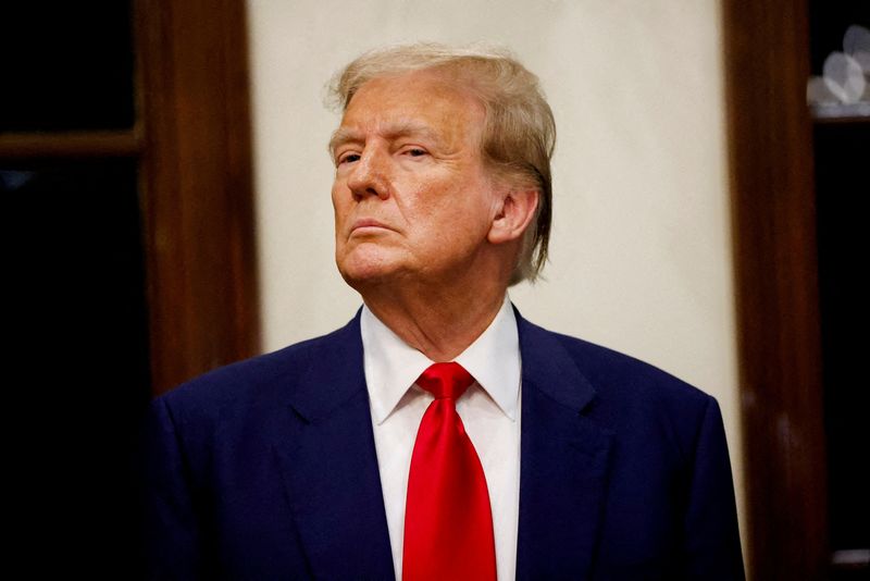 © Reuters. FILE PHOTO: Republican presidential candidate and former U.S. President Donald Trump attends the 2024 Senior Club Championship award ceremony at his Trump International Golf Club in West Palm Beach, Florida, U.S. March 24, 2024.  REUTERS/Marco Bello/File Photo/File Photo