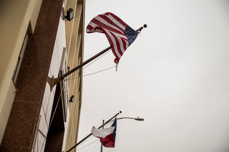 &copy; Reuters. FILE PHOTO: The U.S. and Texas flags wave as a court hearing is held on Texas Governor Greg Abbott's order that parents of transgender children be investigated for child abuse, in Austin, Texas, U.S. March 11, 2022.  REUTERS/Sergio Flores/File Photo