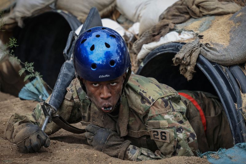 &copy; Reuters. Tusajigwe Owens crawls out of a tunnel in the assault course, a grueling obstacle course that is meant to simulate many facets of a combat zone, at Jacks Valley during the field portion of their basic training at the U.S. Air Force Academy in Colorado Spr