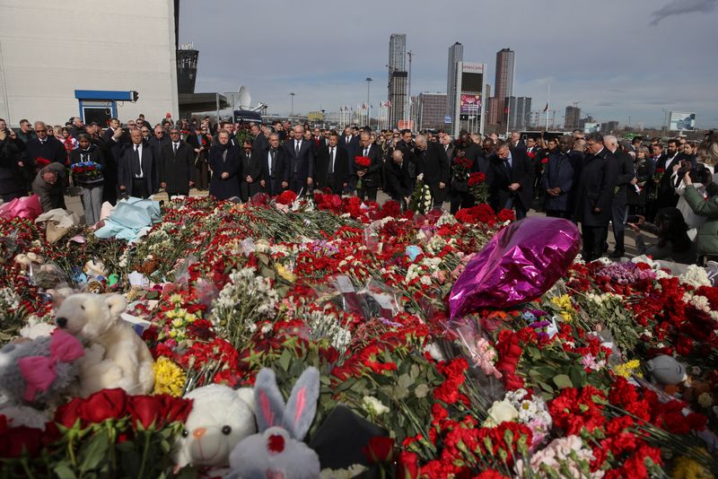 &copy; Reuters. Ambassadors and representatives of diplomatic missions accredited in Russia attend a flowers laying ceremony at the memorial for the victims of the attack at Crocus City Hall concert venue in Krasnogorsk, outside Moscow, Russia, March 30, 2024. SERGEI ILN