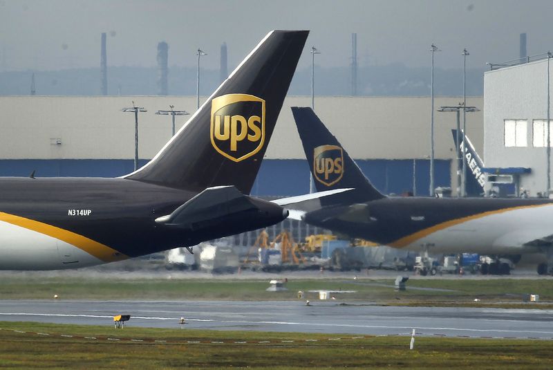 © Reuters. FILE PHOTO: United Parcel Service (UPS) cargo planes are seen in the cargo area of Cologne/Bonn airport near Cologne October 31, 2010. REUTERS/Ina Fassbender/File Photo