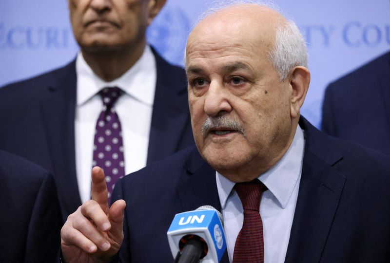 &copy; Reuters. Palestinian Ambassador to the United Nations Riyad Mansour speaks with the media following a meeting of the Security Council to vote on a Gaza resolution that demands an immediate ceasefire for the month of Ramadan leading to a permanent sustainable cease