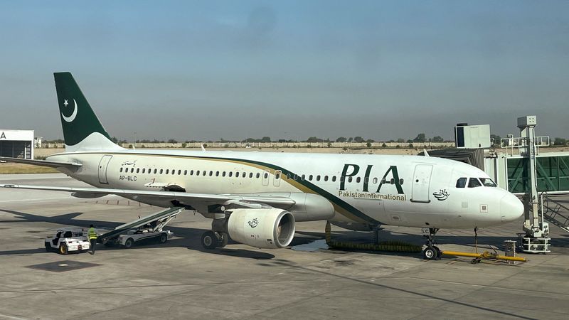 &copy; Reuters. FILE PHOTO: View of a Pakistan International Airlines (PIA) passenger plane, taken through a glass panel, at Islamabad International Airport, Pakistan October 3, 2023. REUTERS/Akhtar Soomro/File Photo