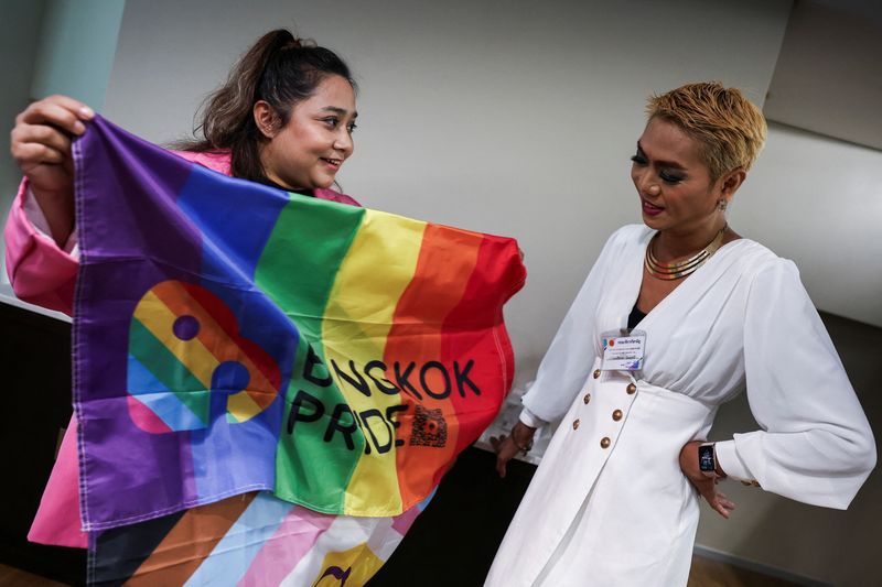 &copy; Reuters. Waaddao Chumaporn, 40, and Siritata Ninlapruek, 45, react after the passing of the marriage equality bill in its first reading by the Senate, which will effectively make Thailand Asia's third territory to legalise same-sex unions, in Bangkok, Thailand, Ap