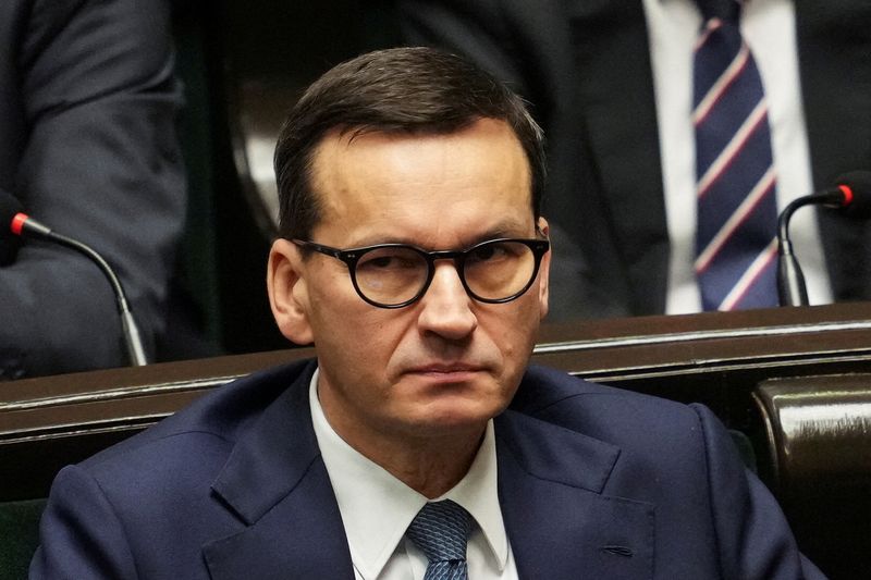 &copy; Reuters. FILE PHOTO: Former Polish Prime Minister Mateusz Morawiecki looks on as Prime Minister Donald Tusk (not pictured) presents his government's programme and asks for a vote of confidence in Parliament in Warsaw, Poland December 12, 2023. REUTERS/Aleksandra S