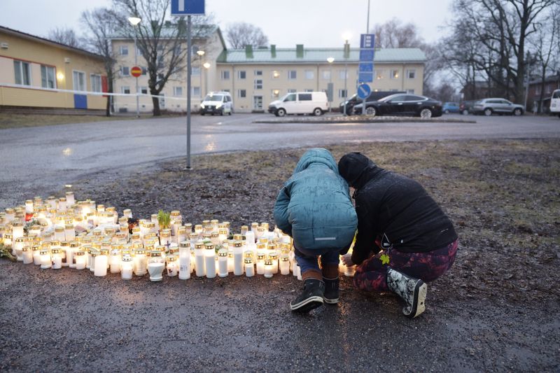 &copy; Reuters. People bring candles and flowers at the Viertola school in Vantaa, Finland, on April 2, 2024. REUTERS/ File photo