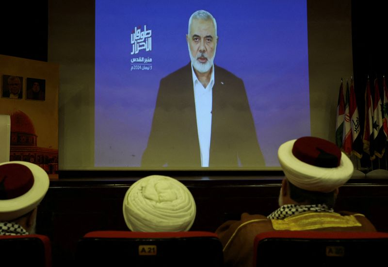 &copy; Reuters. Hamas chief Ismail Haniyeh speaks in a pre-recorded message shown on a screen during an event ahead of al-Quds (Jerusalem) Day on Friday April 5, Lebanon, April 3, 2024. REUTERS/Mohamed Azakir