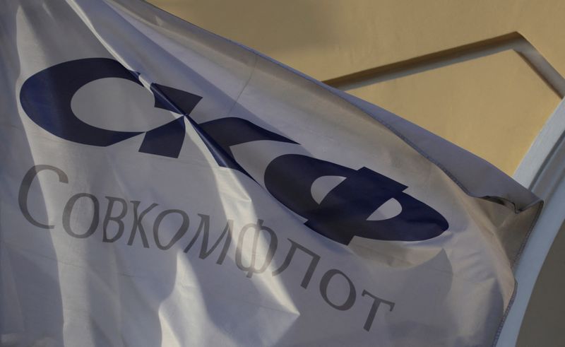 &copy; Reuters. FILE PHOTO: A flag depicting the logo of the Russian state-owned shipping conglomerate Sovcomflot, flies outside the company's hearquarters in St. Petersburg, Russia, May 17, 2017. REUTERS/Anton Vaganov/File Photo
