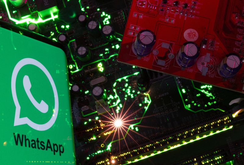 &copy; Reuters. FILE PHOTO: A smartphone with a displayed WhatsApp logo is placed on a computer motherboard in this illustration taken February 23, 2023. REUTERS/Dado Ruvic/Illustration/File photo