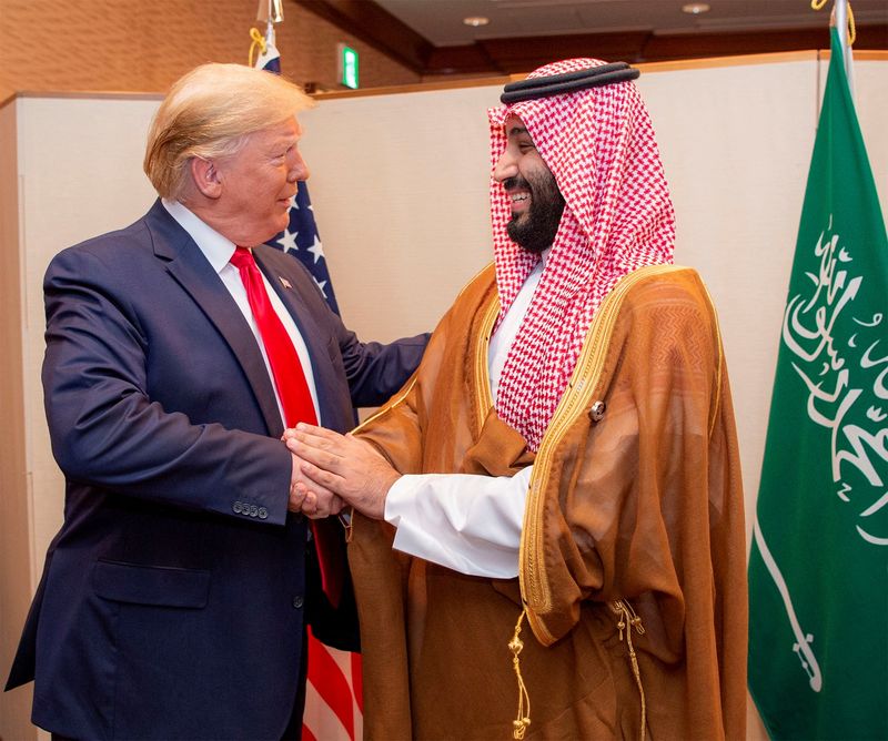 &copy; Reuters. FILE PHOTO: Saudi Arabia's Crown Prince Mohammed bin Salman shakes hands with U.S. President Donald Trump, at the G20 leaders summit in Osaka, Japan, June 29, 2019. Bandar Algaloud/Courtesy of Saudi Royal Court/Handout via REUTERS/File Photo