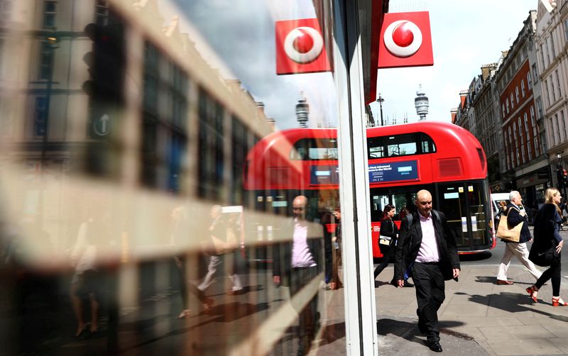 &copy; Reuters. A branded sign is displayed on a Vodafone store in London, Britain May 16, 2017. REUTERS/Neil Hall/File Photo