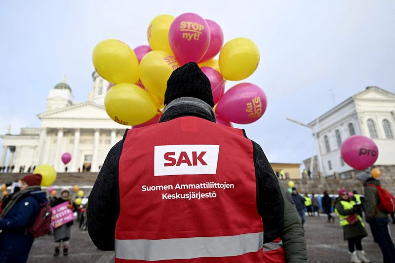 &copy; Reuters. A man wearing a red vest of the Central Organisation of Finnish Trade Unions (SAK) takes part in the Stop Now! demonstration against Finland's government's labour market policies at the Senate Square in Helsinki, Finland, February 1, 2024. Lehtikuva/Vesa 
