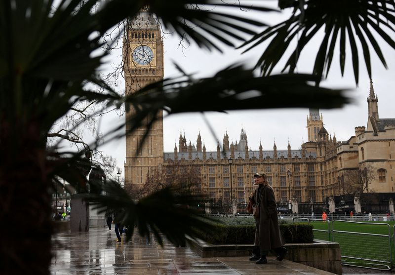 © Reuters. FILE PHOTO: People walk near the Elizabeth Tower, more commonly known as Big Ben, and the Houses of Parliament in London, Britain, February 22, 2024. REUTERS/Isabel Infantes/File Photo