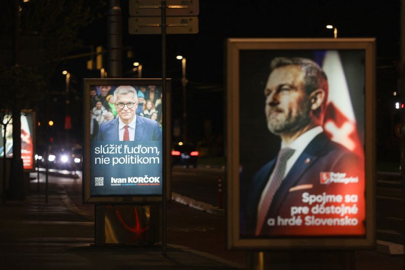 &copy; Reuters. Election posters show Slovak presidential candidates Ivan Korcok and Peter Pellegrini ahead of run-off round of the Slovak presidential election, in Bratislava, Slovakia, April 5, 2024. Posters read: "To serve people, not politicians. Ivan Korcok" and "Pe