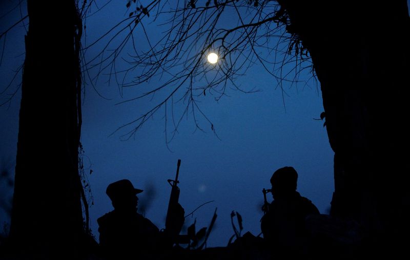 &copy; Reuters. FILE PHOTO: Members of the People's Defence Forces (PDF) who became guerrilla fighters after being protesters are seen on the front line in Kawkareik, Myanmar December 19, 2021. Picture taken December 19, 2021. REUTERS/Stringer/File Photo