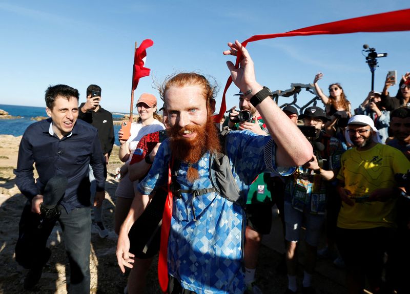 &copy; Reuters. Britain's Russ Cook becomes the first person to run the entire length of Africa - Tunisia - April 7, 2024 Britain's Russ Cook reacts after becoming the first person to run the entire length of Africa REUTERS/Zoubeir Souissi