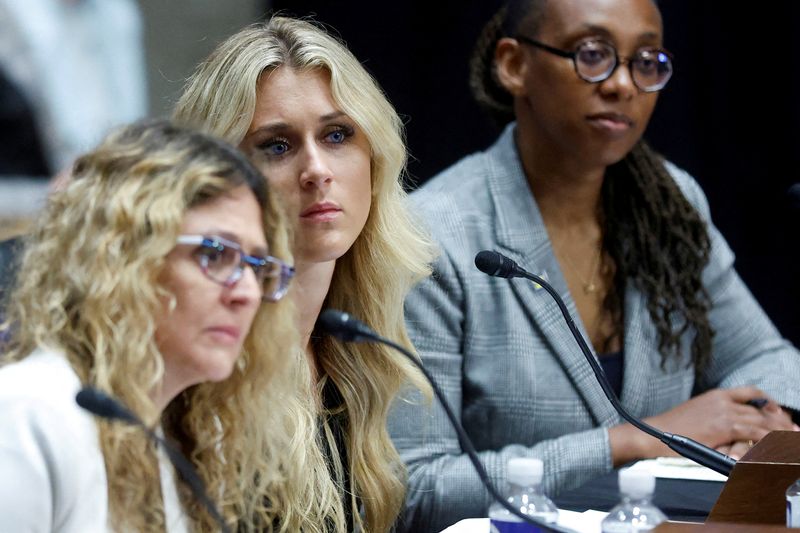 &copy; Reuters. FILE PHOTO: Pediatric endocrinologist Dr. Ximena Lopez, Independent Women's Voice spokeswoman Riley Gaines and Human Rights Campaign President Kelley Robinson testify before a U.S. Senate Judiciary Committee hearing on LGBTQ+ people and their Civil Rights