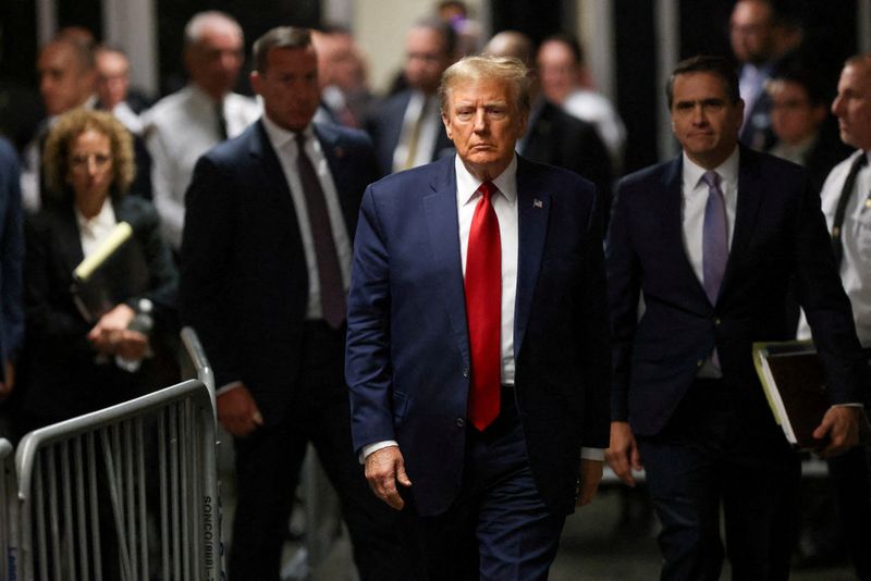 &copy; Reuters. FILE PHOTO: Former U.S. President Donald Trump walks outside the courtroom on the day of a court hearing on charges of falsifying business records to cover up a hush money payment to a porn star before the 2016 election, in New York State Supreme Court in