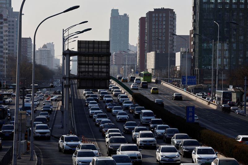 &copy; Reuters. FILE PHOTO: Cars move on a street at the Beijing's Central Business District (CBD), during the morning rush hour following the Chinese Lunar New Year holiday, in Beijing, China, January 30, 2023. REUTERS/Tingshu Wang/File Photo