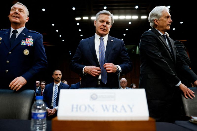 © Reuters. FILE PHOTO: FBI Director Christopher Wray, CIA Director William Burns and Defense Intelligence Agency (DIA) Director Air Force Lt. Gen. Jeffrey Kruse arrive to testify at a Senate Intelligence Committee hearing on worldwide threats to American security, on Capitol Hill in Washington, U.S., March 11, 2024. REUTERS/Julia Nikhinson/File Photo