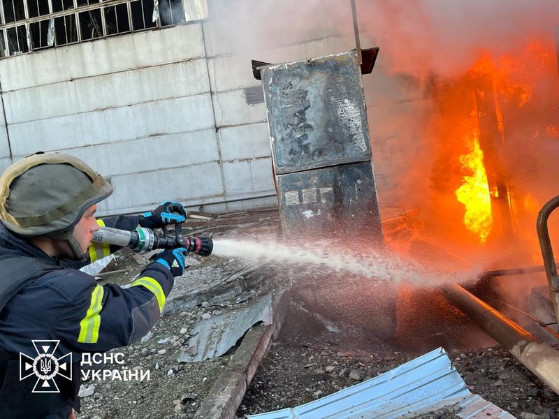 &copy; Reuters. A firefighter works at a compound of power infrastructure facilities, which was hit by Russian missile and drone strikes, amid Russia's attack on Ukraine, at an undisclosed location in Ukraine April 11, 2024. Press service of the State Emergency Service o