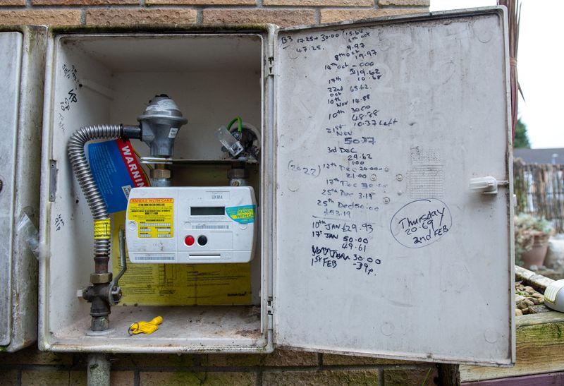 &copy; Reuters. A pre payment gas meter is seen on the outside of a house with a handwritten tally of credit and debt in Cardiff, Britain February 3, 2023.    REUTERS/Natasha Hirst/File Photo