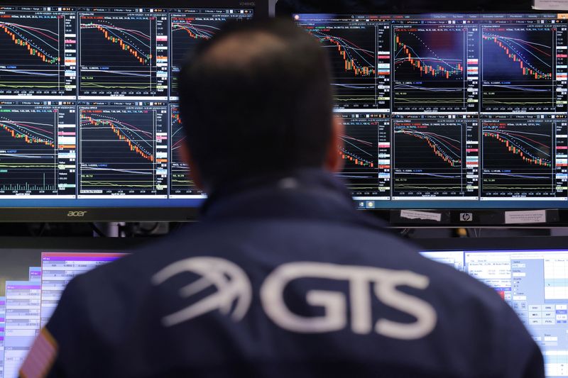 &copy; Reuters. Market information is displayed on monitors as a trader works on the trading floor at the New York Stock Exchange (NYSE) in New York City, U.S., April 4, 2024. REUTERS/Andrew Kelly