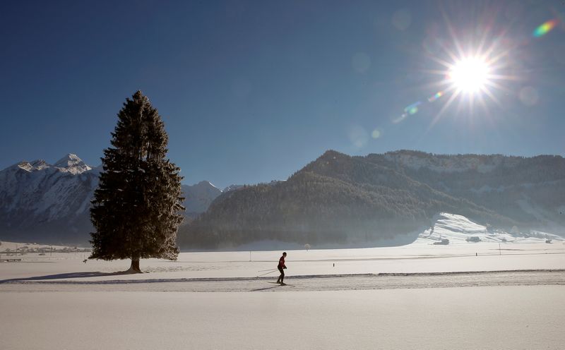 &copy; Reuters. FILE PHOTO: A cross-country skier is seen in the snow-covered landscape during sunny winter weather near Unteriberg, Switzerland January 20, 2017.  REUTERS/Arnd Wiegmann 