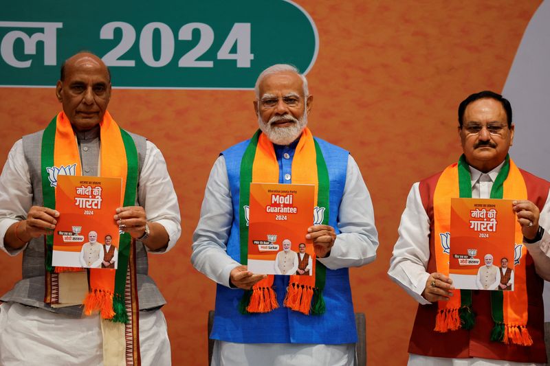 &copy; Reuters. Indian Defence Minister Rajnath Singh, Prime Minister Narendra Modi and President of the Bharatiya Janata Party J. P. Nadda display copies of the ruling Bharatiya Janata Party's (BJP) election manifesto for the general election, in New Delhi, India, April