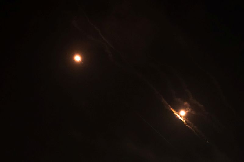 &copy; Reuters. Objects are seen in the sky above Jerusalem after Iran launched drones and missiles towards Israel, in Jerusalem April 14, 2024. REUTERS/Ronen Zvulun