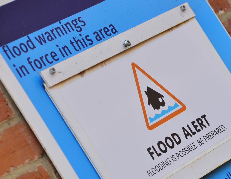 &copy; Reuters. FILE PHOTO: A flood status sign is pictured on a wall in the village of Hurley in southern England, January 13, 2014. REUTERS/Toby Melville/File Photo